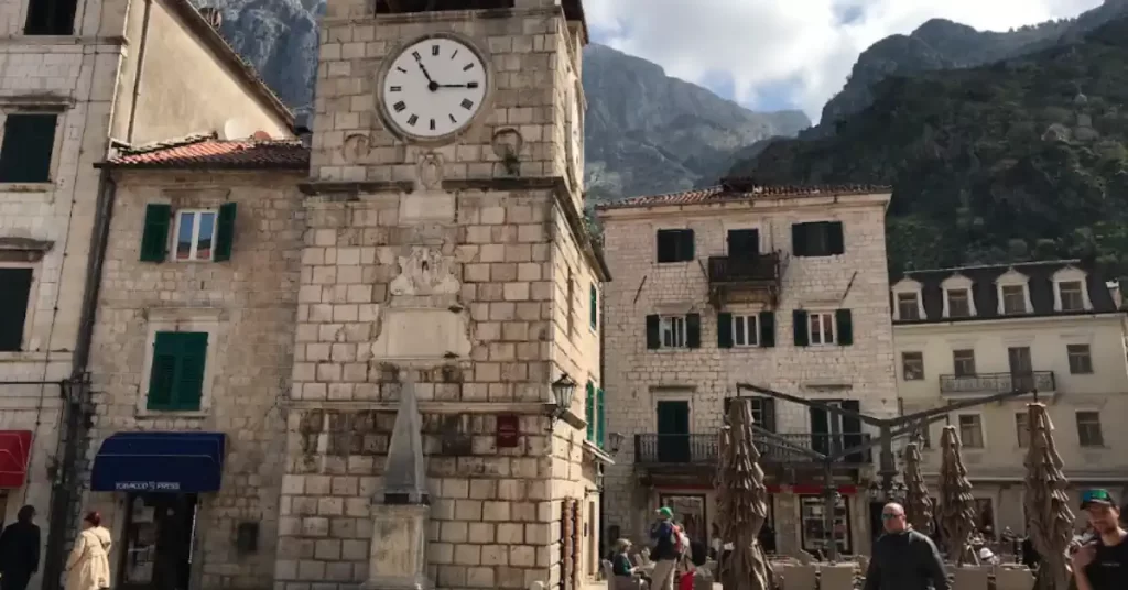 Kotor Old town clock tower arms square